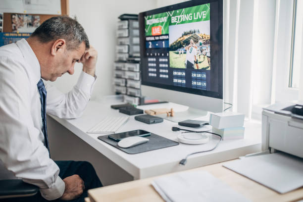 istock An unlucky man, he lost in sports betting using a computer 1200706509