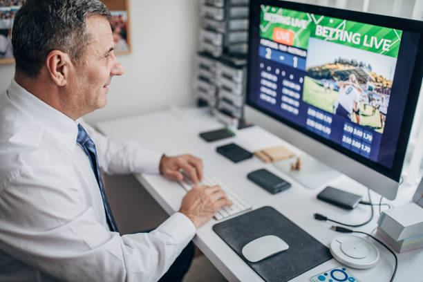 istock Live sports betting at the office using a computer 1200707054
