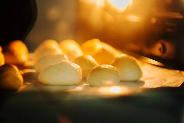 istock Dessert eclairs, baking and growth in the oven. 1200707288