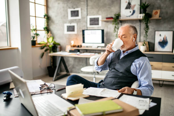 istock Senior man focused and working in a business desk designer studio 1200708777