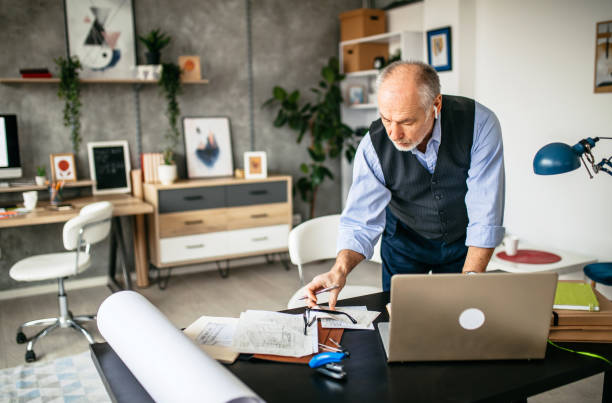 istock Mature businessman working in his studio 1200708946