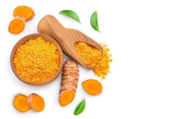 istock Turmeric powder and turmeric root isolated on white background with copy space for your text. Top view. Flat lay 1200710778