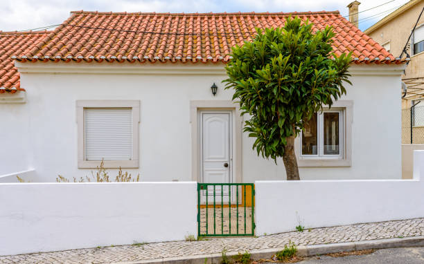 Azambuja, Portugal - October 18, 2019: A small white house with red tiles
