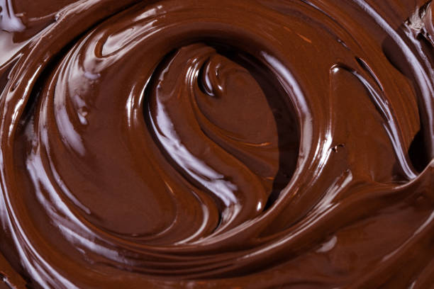 istock Chocolate texture. Liquid chocolate close-up.Textured dark chocolate 1200711419