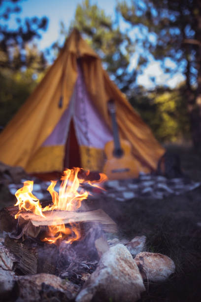 istock Campfire outside of tent 1200711773