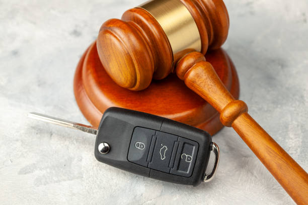 Car accident. Judge gavel and car bleeding with alarm. Car Insurance Solution stock photo