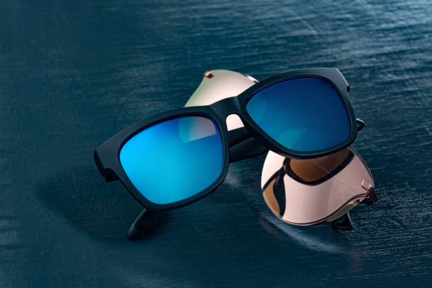 istock Two fashionable sunglasses on a blue background. 1200714836
