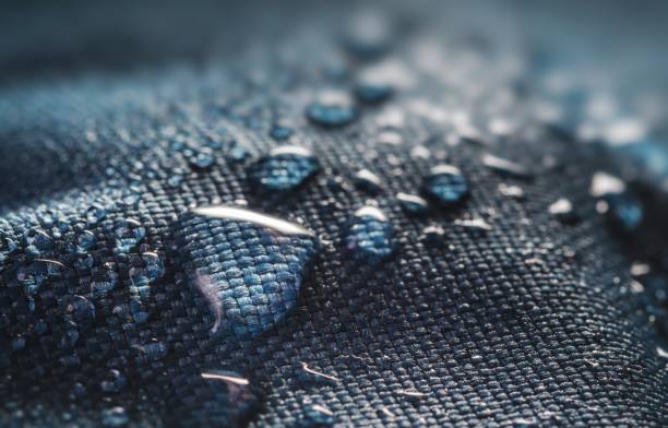 Many water drops on waterproof impregnated textile.