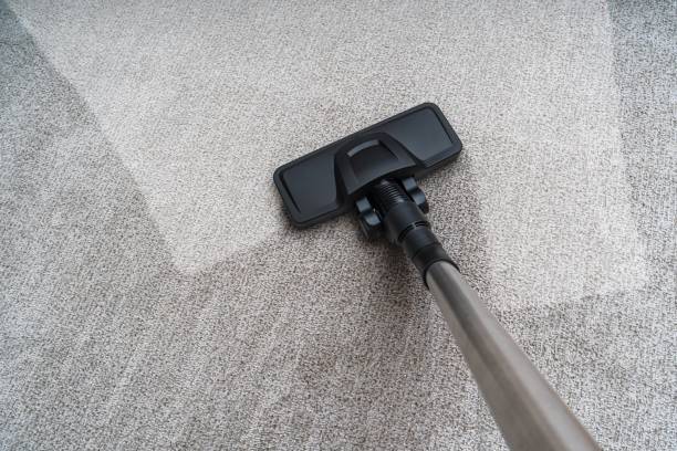 istock Vacuum cleaner is cleaning dirty carpet. Housework concept. 1200715483
