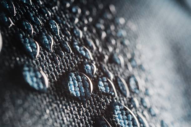 istock Close-up view on water drops on black umbrella. 1200715491