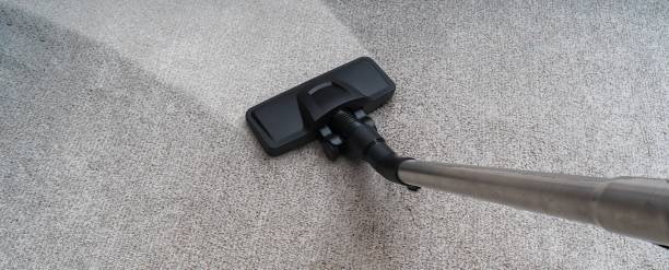 istock Cleaning dirty carpet with vacuum cleaner. Household concept. 1200715525