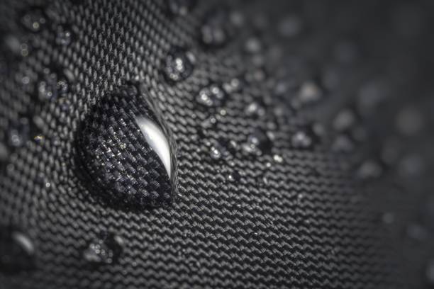 istock Water drop on waterproof impregnated fabric of black umbrella during rain. 1200715536