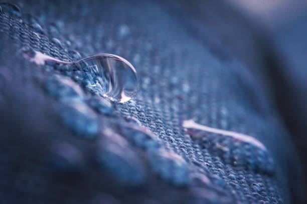 istock Water drops on impregnated waterproof fabric. 1200715583
