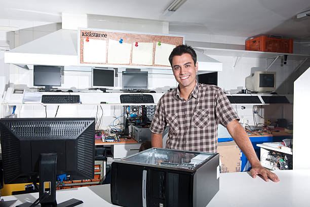 Small business: Happy owner of a computer repair store