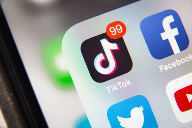 TikTok and Facebook application  on screen Apple iPhone XR Tyumen, Russia - January 21, 2020: TikTok and Facebook application  on screen Apple iPhone XR tiktokple stock pictures, royalty-free photos & images