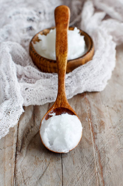 istock Coconut oil in a bowl with a spoon 1200716554