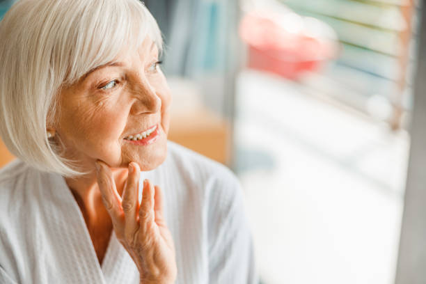 istock Joyful elderly lady looking away and smiling 1200716561