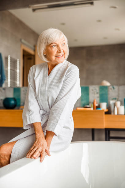 istock Smiling old woman resting in spa salon 1200716570