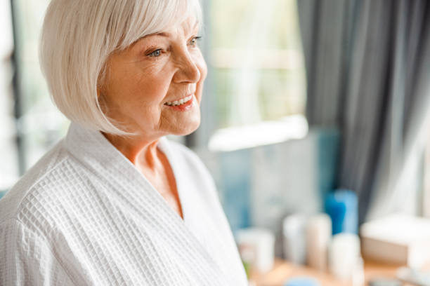 istock Cheerful old woman looking away and smiling 1200716582