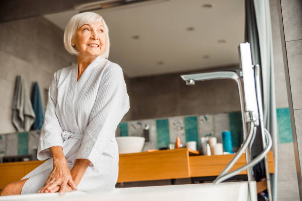 istock Cheerful elderly woman resting in spa salon 1200716608