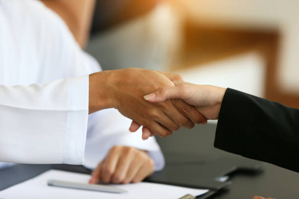istock Cropped Image Of Man Hand Shaking Over Table 1200719040