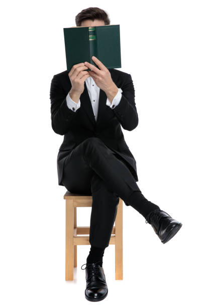 istock young elegant model reading and covering face with book 1200721027