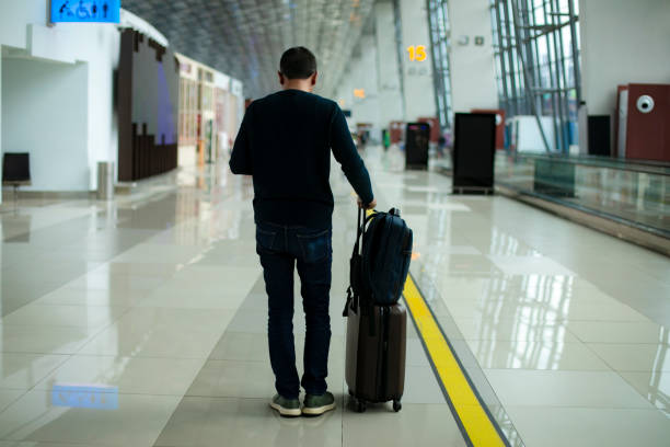istock Businessman with baggage on the go 1200725695