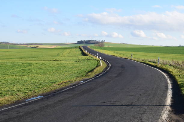 istock old country road in green hills 1200726908