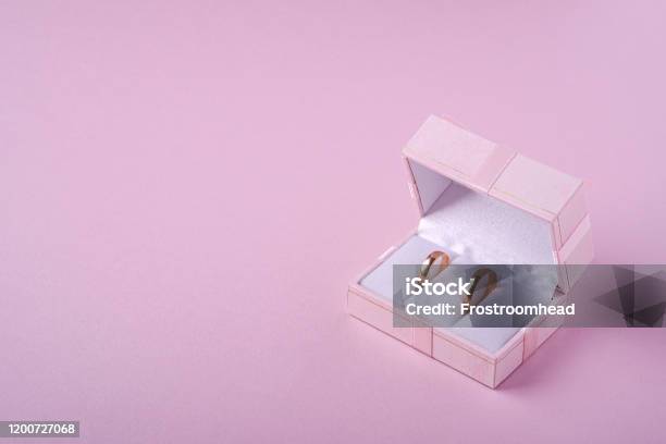 Wedding Gold Rings In Pink Gift Box On Soft Pink Background Angle View Copy Space Stock Photo - Download Image Now
