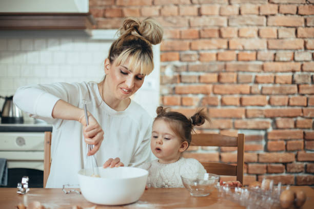 istock Mother and daughter in the kitchen 1200730698