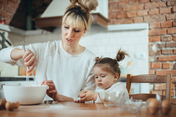 istock Mother and daughter in the kitchen 1200730868