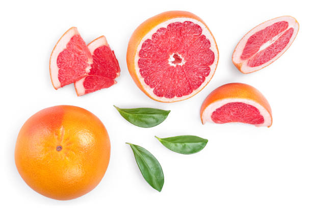 istock Grapefruit and slices with leaves isolated on white background. Top view. Flat lay 1200731406
