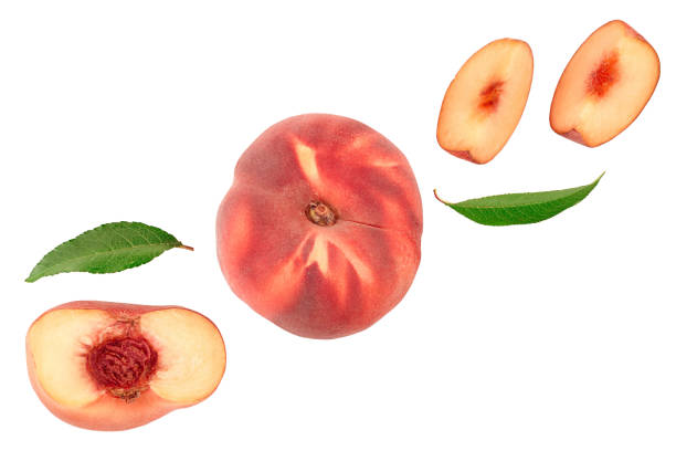 istock Ripe chinese flat peach fruit and half with leaf isolated on white background with copy space for your text. Top view. Flat lay 1200731418