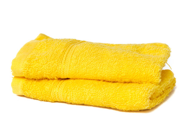 istock Yellow towels isolated on white 1200732249