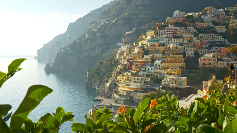 Positano, Amalfi, Italy.  Gimbal shot of Positano village at sunset. 4K