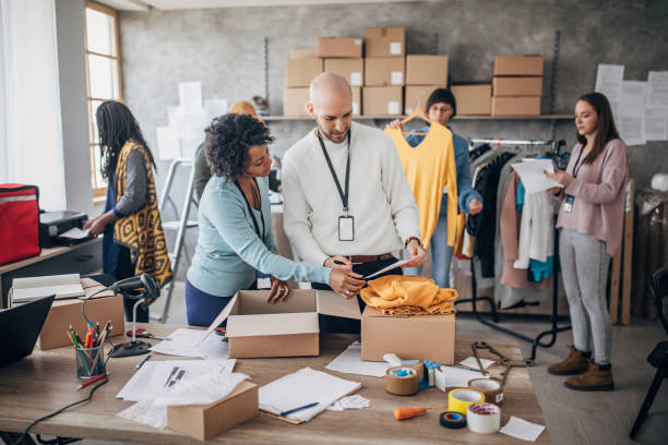 istock Diverse group of people arranging customers orders for drop shipping 1200737971