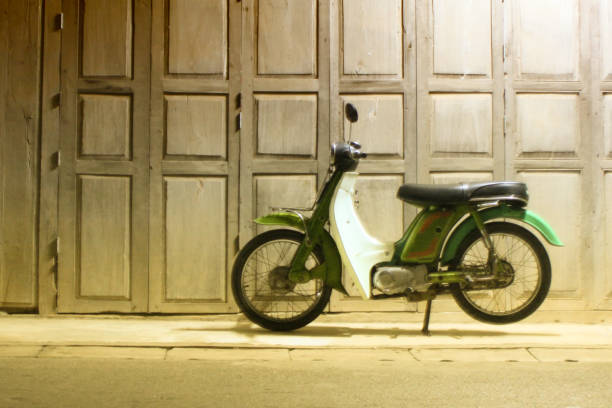 istock Motorcycle in front of wood house 1200739459