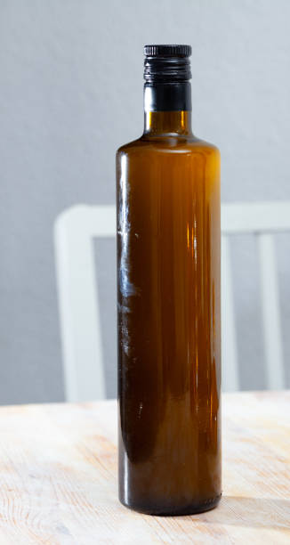 istock Bottle with olive oil on the table 1200740071