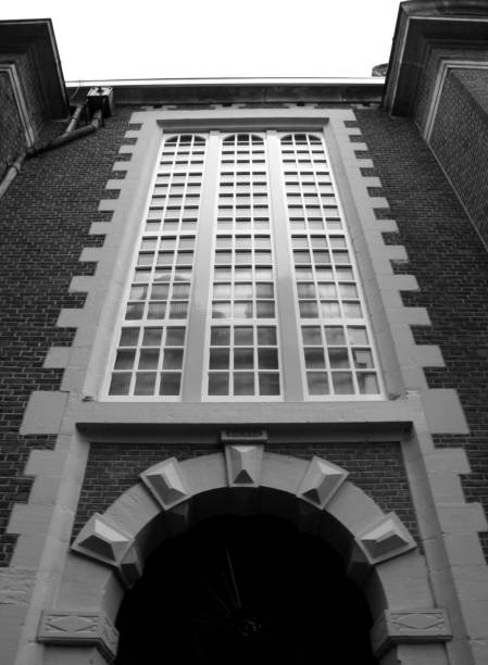 Traditional buildings of Amsterdam. Warehouses and house fronts in Black and white.