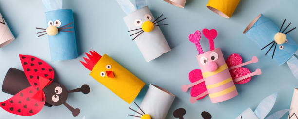 istock Happy easter kindergarten decoration concept - rabbit, chicken, egg, bee from toilet paper roll tube. Simple diy creative idea. Eco-friendly reuse recycle banner, daycare paper craft 1200740339
