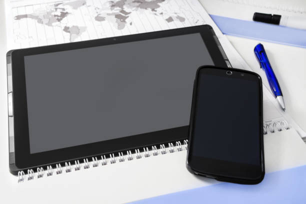 istock Handy and tablet and desk background 1200746722