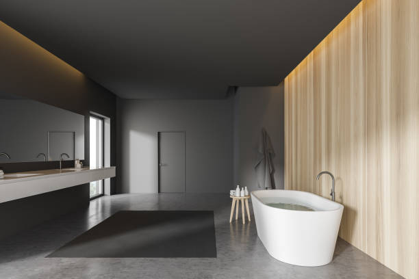 istock Gray and light wooden bathroom with door 1200749031
