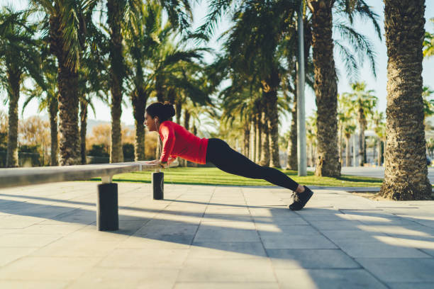 istock Sportswoman doing push-ups 1200750831