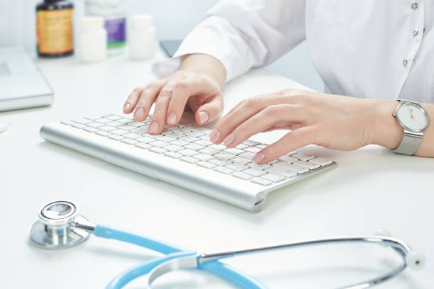 istock A female doctor is working on a computer 1200750933