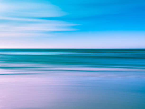 istock Blurred panning motion background of waves at seashore 1200750983
