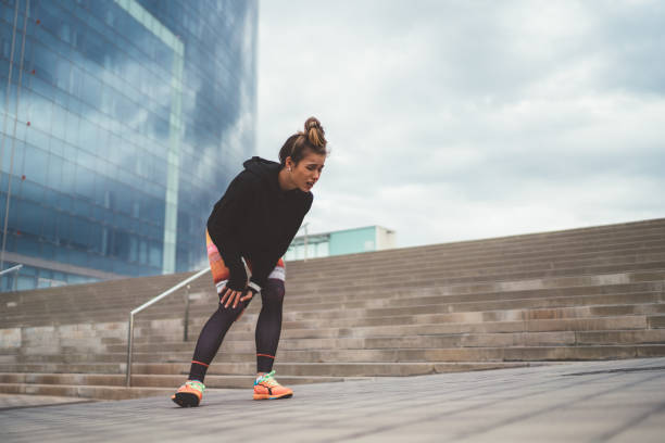 istock Sportswoman with sprained ankle 1200751020