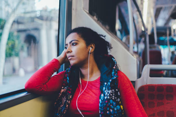 Mixed race woman traveling in bus