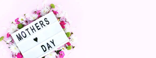 Photo of Banner for the site with a lightbox and the inscription Mother's Day.