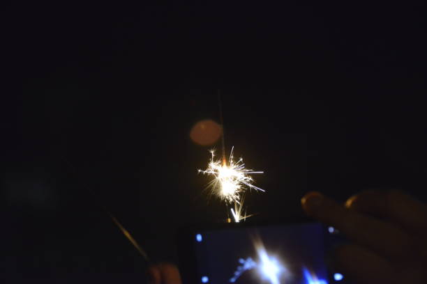 istock Photographing firework with a mobile phone 1200752392