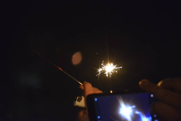 istock Photographing firework with a mobile phone 1200752416